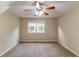 Spacious bedroom with neutral carpet and a ceiling fan at 3891 Northstrand Dr, Decatur, GA 30035