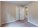 Bedroom featuring carpet, double closet, and doorway leading to another room at 3891 Northstrand Dr, Decatur, GA 30035