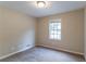 Cozy bedroom with neutral tones, carpet flooring, and a window allowing natural light at 3891 Northstrand Dr, Decatur, GA 30035