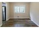 Dining room with wood-look floors and a view of the backyard at 3891 Northstrand Dr, Decatur, GA 30035