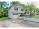Charming two-story home with an attached garage and a concrete driveway at 3891 Northstrand Dr, Decatur, GA 30035