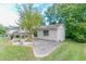 Side view of the charming one-story home with a spacious driveway and lush greenery at 3891 Northstrand Dr, Decatur, GA 30035
