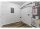 Utility room with wood floor, water heater, and white walls at 3891 Northstrand Dr, Decatur, GA 30035