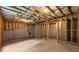 Unfinished basement featuring exposed framing and concrete foundation at 7580 Sunridge Ln, Douglasville, GA 30135