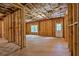 Unfinished basement featuring exposed framing and a walk-out door at 7580 Sunridge Ln, Douglasville, GA 30135