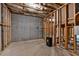 Unfinished basement featuring exposed framing, concrete walls, and utility connections at 7580 Sunridge Ln, Douglasville, GA 30135
