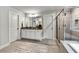 Bright bathroom featuring a double vanity, granite countertops, and a glass-enclosed shower at 7580 Sunridge Ln, Douglasville, GA 30135