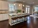 Bright kitchen featuring a large island with granite countertops and seating for four at 7580 Sunridge Ln, Douglasville, GA 30135