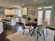 Cozy kitchen with a central island, stainless steel appliances, and access to an outdoor deck at 7580 Sunridge Ln, Douglasville, GA 30135