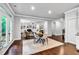 Open living area with hardwood floors, a fireplace, and seamless flow from the kitchen at 7580 Sunridge Ln, Douglasville, GA 30135