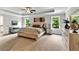 Spacious main bedroom with tray ceiling and ample natural light creates a peaceful retreat at 7580 Sunridge Ln, Douglasville, GA 30135