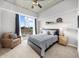Bright bedroom featuring a ceiling fan, a large window and comfortable seating at 563 Memorial Se Dr # 504, Atlanta, GA 30312