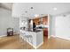 Well-lit kitchen with hardwood floors, a breakfast bar, and stainless steel appliances at 563 Memorial Se Dr # 504, Atlanta, GA 30312