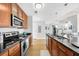 Well-equipped kitchen featuring granite countertops, stainless steel appliances, and plenty of storage space at 563 Memorial Se Dr # 504, Atlanta, GA 30312