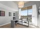 Bright office space with a large window, modern desk, and balcony access at 563 Memorial Se Dr # 504, Atlanta, GA 30312