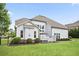 Expansive backyard offering plenty of green space and a patio area at 5950 Thoroughbred Way, Suwanee, GA 30024