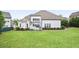 Spacious backyard with lawn and a white-fenced patio at 5950 Thoroughbred Way, Suwanee, GA 30024