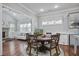 Eat in kitchen featuring granite countertops, stainless appliances, and breakfast nook at 5950 Thoroughbred Way, Suwanee, GA 30024