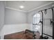 Workout room with hardwood floors, wainscoting and exercise equipment at 5950 Thoroughbred Way, Suwanee, GA 30024