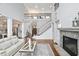 Spacious living room shows the staircase, fireplace, and open floor plan, creating a welcoming atmosphere at 5950 Thoroughbred Way, Suwanee, GA 30024