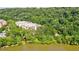 Aerial view of the community nestled amongst a dense forest near the river at 900 River Vista Dr, Atlanta, GA 30339