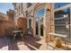 A charming balcony with an outdoor dining set extends from a brick townhome exterior at 900 River Vista Dr, Atlanta, GA 30339