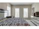 Bright bedroom with black and white patterned bedding and minimalist decor at 900 River Vista Dr, Atlanta, GA 30339