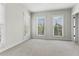 Bedroom with plush neutral carpeting, well-lit windows, and ample natural light at 900 River Vista Dr, Atlanta, GA 30339