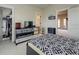 Bright bedroom featuring a closet, TV, modern dresser, and unique patterned bedding at 900 River Vista Dr, Atlanta, GA 30339
