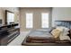 Modern bedroom with sleek furniture and abundant natural light from the dual windows at 900 River Vista Dr, Atlanta, GA 30339
