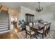 Elegant dining room with hardwood floors and staircase near the kitchen and living room at 900 River Vista Dr, Atlanta, GA 30339
