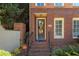 Inviting entryway with brick steps, decorative wreath, and clear house number at 900 River Vista Dr, Atlanta, GA 30339