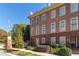 Charming brick townhome with landscaped front yard and a welcoming entryway at 900 River Vista Dr, Atlanta, GA 30339