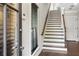 Home foyer features hardwood flooring and a staircase with oak railings at 900 River Vista Dr, Atlanta, GA 30339