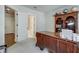 Cozy home office space with dark wood furniture, neutral walls, and plenty of light at 900 River Vista Dr, Atlanta, GA 30339