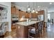 Modern kitchen with granite countertops, stainless steel appliances, seating at the island, and hardwood floors at 900 River Vista Dr, Atlanta, GA 30339