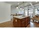 Spacious kitchen with island seating, stainless steel appliances, and a seamless connection to the living area at 900 River Vista Dr, Atlanta, GA 30339