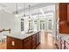 Kitchen with granite countertops, stainless appliances, and view to the living area with fireplace at 900 River Vista Dr, Atlanta, GA 30339