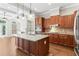 Kitchen with hardwood floors, granite counters, and stainless appliances in open concept floor plan at 900 River Vista Dr, Atlanta, GA 30339