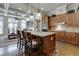 Beautiful kitchen with a central island, granite countertops, stainless appliances, and open floor plan to the living room at 900 River Vista Dr, Atlanta, GA 30339