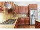 Kitchen featuring stainless steel appliances, granite countertops, gas range, and tiled backsplash at 900 River Vista Dr, Atlanta, GA 30339