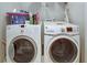 Clean laundry room featuring modern washer and dryer units at 900 River Vista Dr, Atlanta, GA 30339