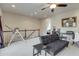 Bright living room with carpet floors and an open view into a bedroom at 900 River Vista Dr, Atlanta, GA 30339