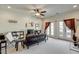 Spacious living room with bright lighting, ceiling fan, and outdoor balcony entrance at 900 River Vista Dr, Atlanta, GA 30339