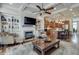 Inviting living room features a fireplace, built-in shelving, and an open layout that flows into a modern kitchen at 900 River Vista Dr, Atlanta, GA 30339