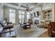 Spacious living room featuring coffered ceilings, built-in shelving, fireplace, and ample natural light at 900 River Vista Dr, Atlanta, GA 30339