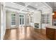 Spacious living room featuring coffered ceilings, a fireplace, and an abundance of natural light at 900 River Vista Dr, Atlanta, GA 30339