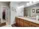 Well-lit main bathroom with double vanity sinks, a soaking tub, and separate shower at 900 River Vista Dr, Atlanta, GA 30339