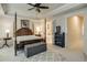 Bright main bedroom featuring a four-poster bed and convenient access to the ensuite bathroom at 900 River Vista Dr, Atlanta, GA 30339