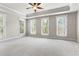 Large primary bedroom with carpet and large windows for natural light at 900 River Vista Dr, Atlanta, GA 30339